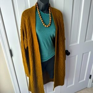 A New Day Long Cardigan Size XS
75% Acrylic- 25% Nylon